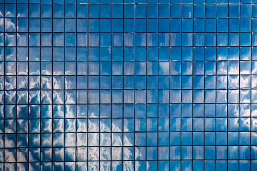 This is a close-up of the Columbus Convention Center. The windows create an abstract design of the reflected skyscape.  Blue is the prominent color.