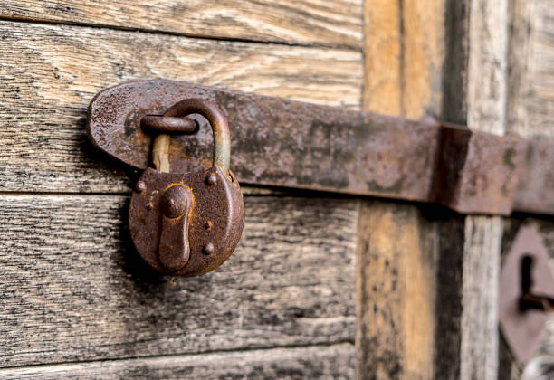 istock Old key lock on a wooden door 1363432274