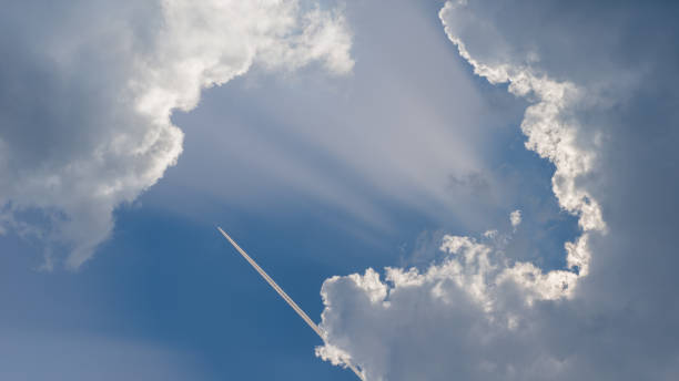 istock Panoramic blue sky with clouds and airliner plane 1363432310