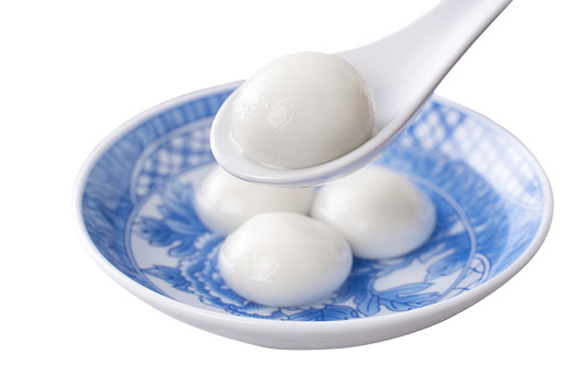 Top view of big tangyuan yuanxiao (yuan xiao tang yuan, glutinous rice dumpling balls) in a bowl isolated on white background for lunar new year festival