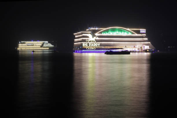 Long exposure night  photo of floating Casinos at River Mandovi in Panjim, Goa, India.  These Casinos anchored at Mandovi River are a major draw for tourists who visit Goa to enjoy nightlife and experiences which are unique to Goan Vacation.