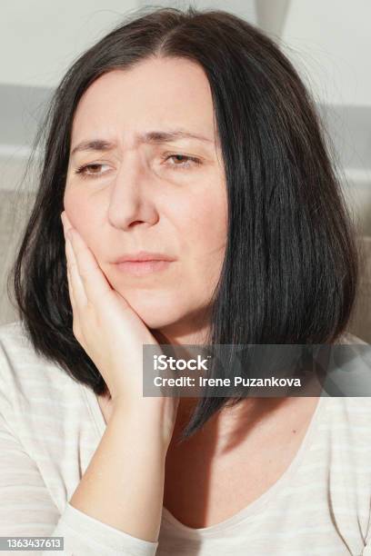 Middle Age Mature Woman Touching Mouth With Hand Suffering From Toothache At Home Dental Health Concept Tooth Decay Inflammation Or Sensitive Teeth Stock Photo - Download Image Now