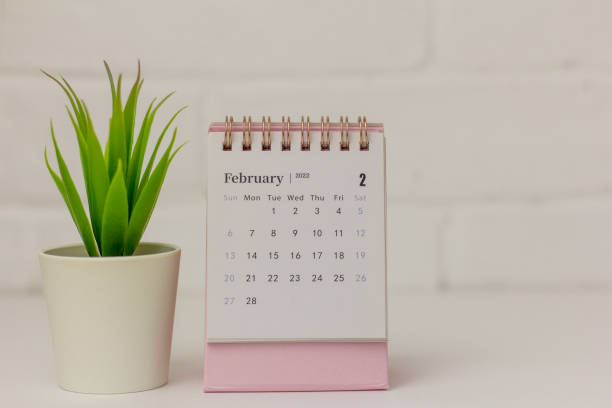 istock Desktop calendar for February 2022 on a light background. 1363438369