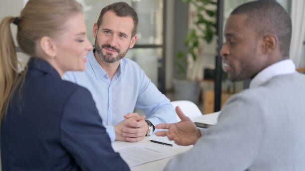 istock Successful Mixed Race Business People Shaking Hands in Office 1363438865