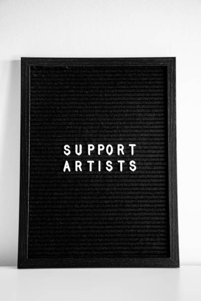 istock Support artists nspirational quote black letter board white background 1363442521