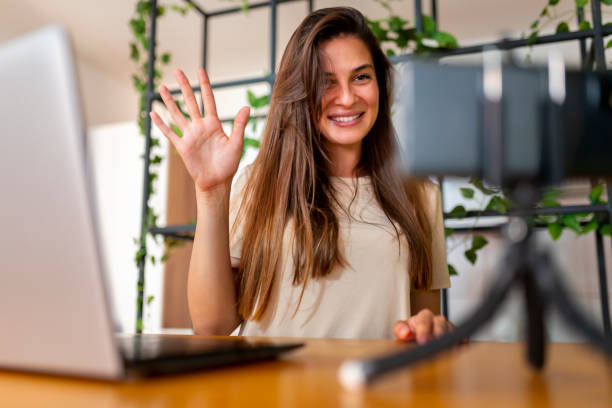 istock Female vlogger recording video 1363442644