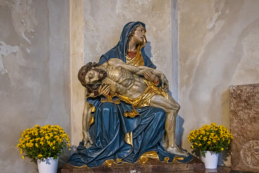 La Pieta figure made as a wood carving in the Holy Cross Church at the road crossing (Alerheiligenkirche am Kreuz) in the German city Munich which is the capital city in Bavaria