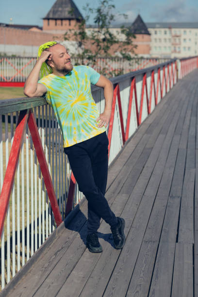 istock A man with an interesting mohawk hairstyle stands on the bridge 1363445021