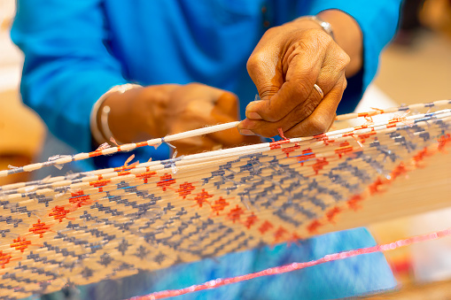 Traditional Isan Thai silk weaving. Mudmee silk or Mudmee fabric is used by contemporary fashion designers around the world for their finest creations.