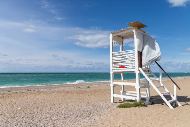 istock White rescue tower at the empty beach. Black sea coast landscape 1363448591