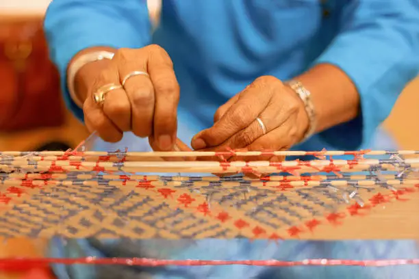 Traditional Isan Thai silk weaving. Mudmee silk or Mudmee fabric is used by contemporary fashion designers around the world for their finest creations.