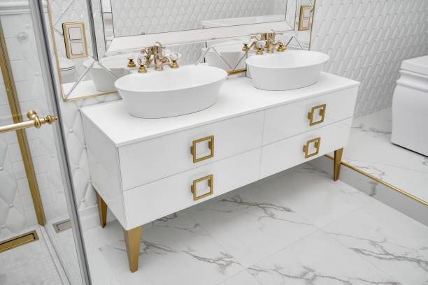 istock Elegant cabinet with vessel sinks by mirror in bathroom 1363449533