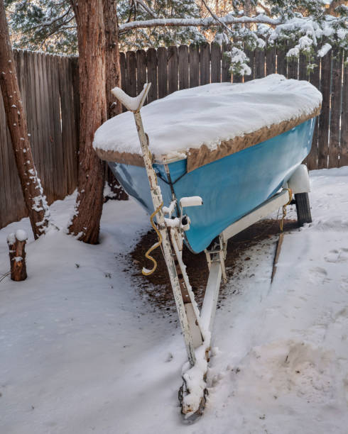 istock sailing dinghy covered by snow on a trailer in backyard 1363455377