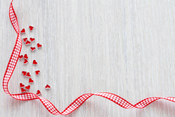 istock Valentine day background, many small hearts and checkered ribbon 1363457043
