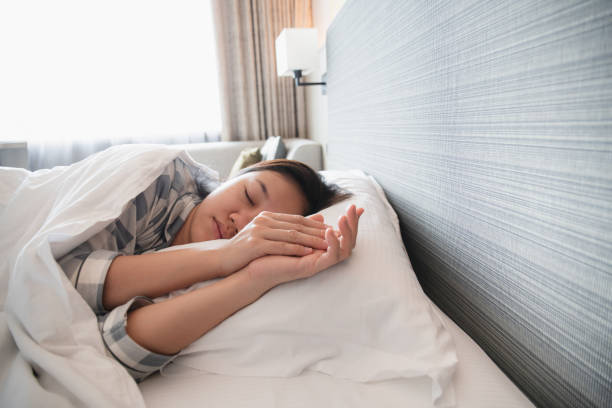 istock Lazy woman waking up from the bed. 1363460227