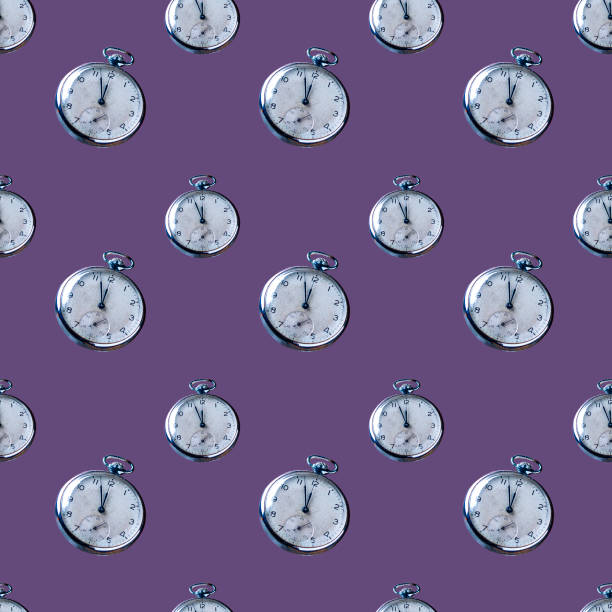 istock vintage clock with a round dial in a metal case on a very peri background, seamless pattern 1363460600