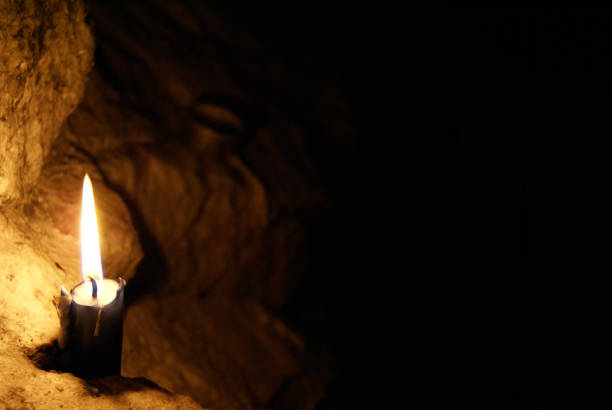 istock A candle light in the darkness 1363461464