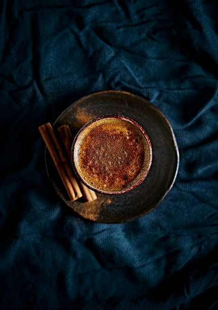 istock Cup of coffee with milk and cinnamon. Top view 1363465233
