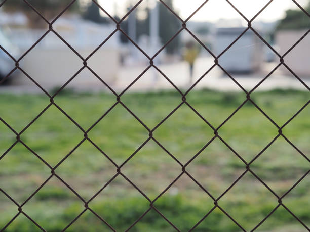 istock A look at the cityscape through a chain-link fence 1363465808