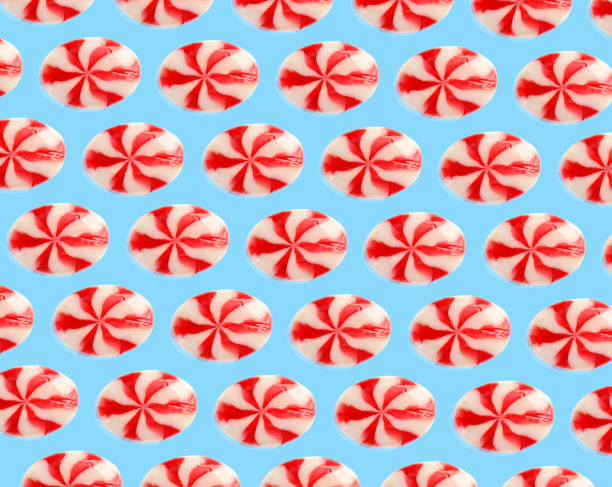 istock Tasty candies on light blue background. Pattern design 1363467987