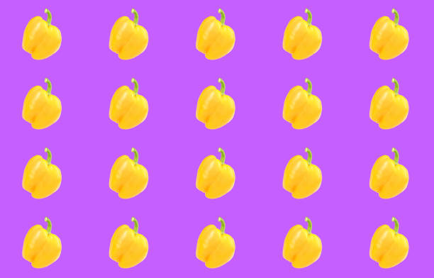 istock Collage with yellow bell peppers on vivid purple background. Pattern design 1363469533
