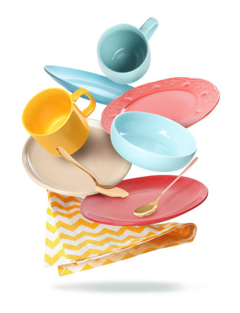 istock Set of clean tableware and napkin in flight on white background 1363469944