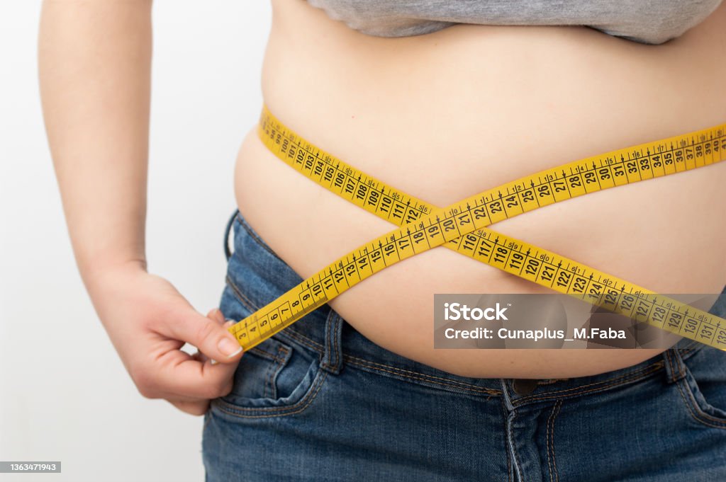 https://media.istockphoto.com/id/1363471943/photo/woman-measuring-her-body-fat-percentage-with-tape-measure.jpg?s=1024x1024&w=is&k=20&c=3jiVQeta9UscpIEG7zfiGDpHJHzoT4pbfE3X0-AEv_c=