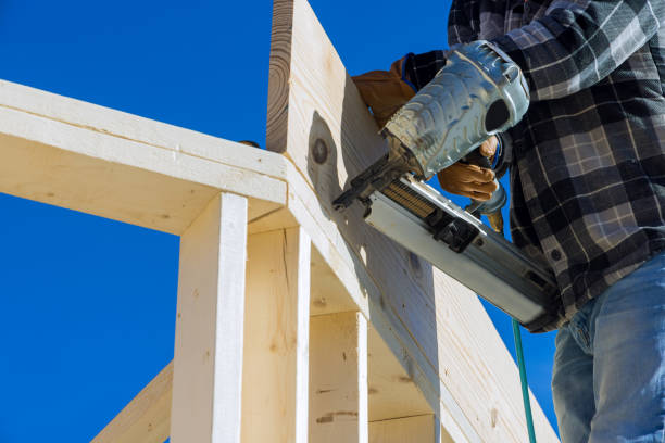 istock A carpenter for nailing wooden beam using an air hammer 1363472244