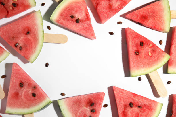 istock Frame made with slices of ripe watermelon on white background, flat lay. Space for text 1363472998