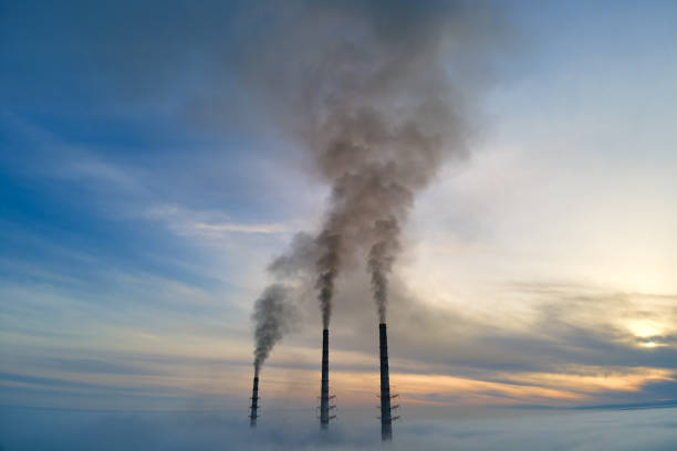istock Aerial view of coal power plant high pipes with black smoke moving up polluting atmosphere at sunset 1363473221
