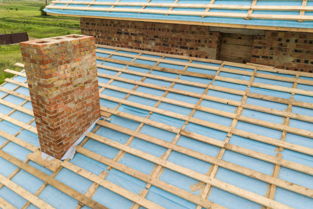 istock Aerial view of a brick house with wooden roof frame under construction. 1363473248