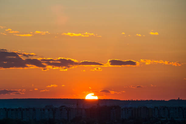 istock Bright colorful sunset sky with rays of setting sun and vivid dark clouds 1363473330