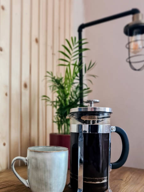 istock French press cafetiere filled with black coffee and mug 1363474149