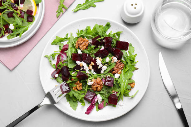 istock Delicious beet salad served on grey table, flat lay 1363474371