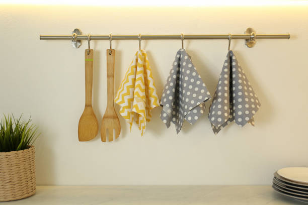 istock Different kitchen towels hanging on hook rack indoors 1363475477
