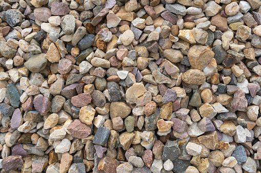Small stones. Textured background. Garden gravel background stone landscaping. Driveway gravel road