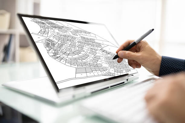 istock Male Executive Looking At Cadastre Map 1363478391