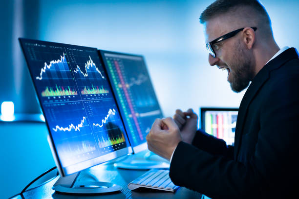 istock Successful Stock Market Trader Looking At Graphs 1363478529