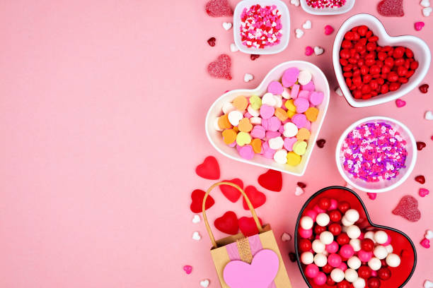 istock Valentines Day candy side border on a pink background 1363480230