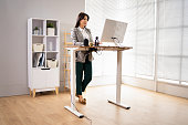 Adjustable Height Desk Stand In Office