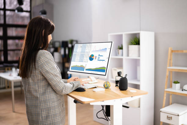 istock Adjustable Height Desk Stand In Office 1363481708