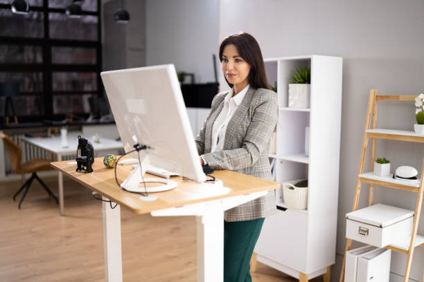 istock Adjustable Height Desk Stand In Office 1363481711