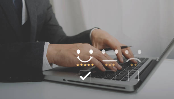 istock Customer service evaluation concept. Businessman pressing face smile emoticon show on virtual screen. Survey, poll or questionnaire for user experience or customer satisfaction research. 1363485124