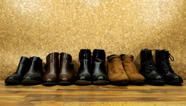 istock stylish leather pair ankle and heels boots isolated on wooden background 1363485151