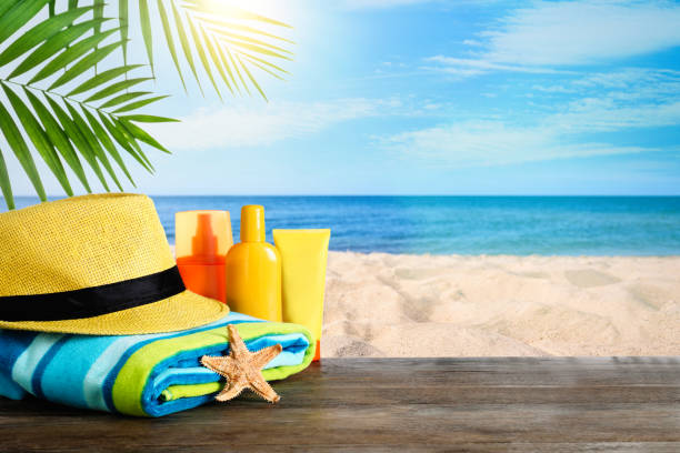 istock Beach objects on wooden table near sea, space for text. Summer vacation 1363486933