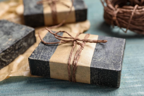 istock Natural tar soap on wooden table, closeup 1363488189