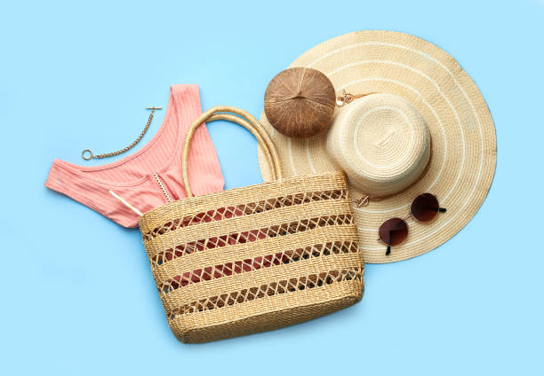istock Flat lay composition with woman's straw bag on light blue background 1363488748