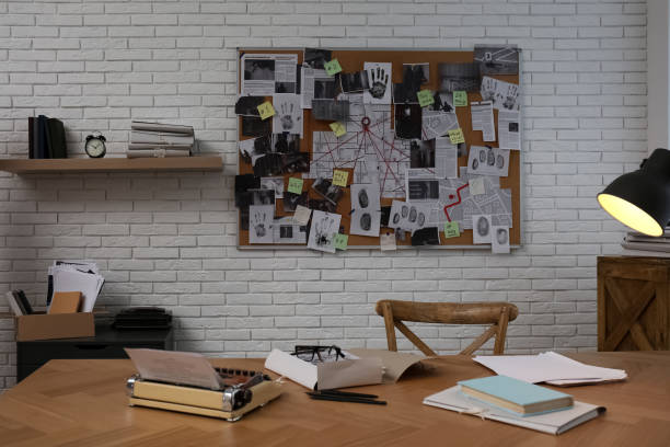 istock Detective office interior with workplace and investigation board 1363488983