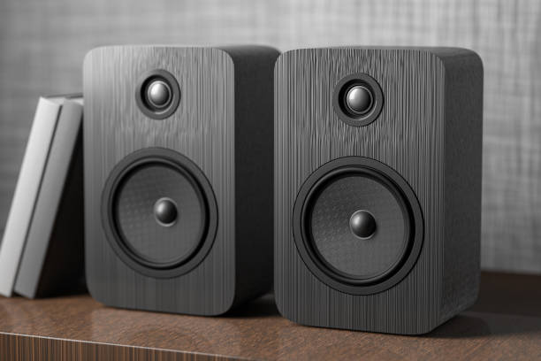 Music speakers on the bookshelf. Professional wooden bookshelf speaker has a classic, elegant look. 3D rendering stock photo