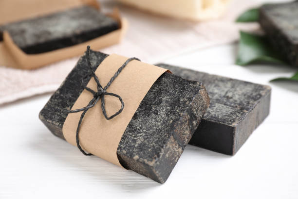 istock Natural tar soap on white table, closeup 1363490097